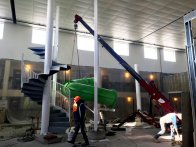 Installing a waterslide using a crane
