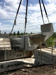 Working on a bridge using a crane